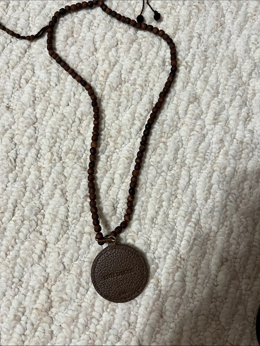 Estée Lauder Brown Wood Bead Necklace with Fox Pendant